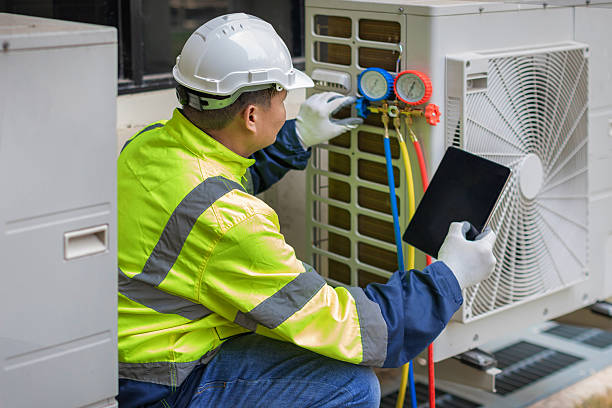 Professional Hvac technician working in Powells Point, NC